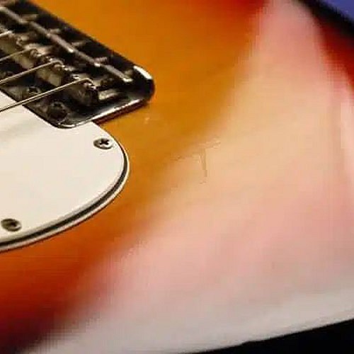 How Does the Strap Affect Instruments with Nitro Lacquer?